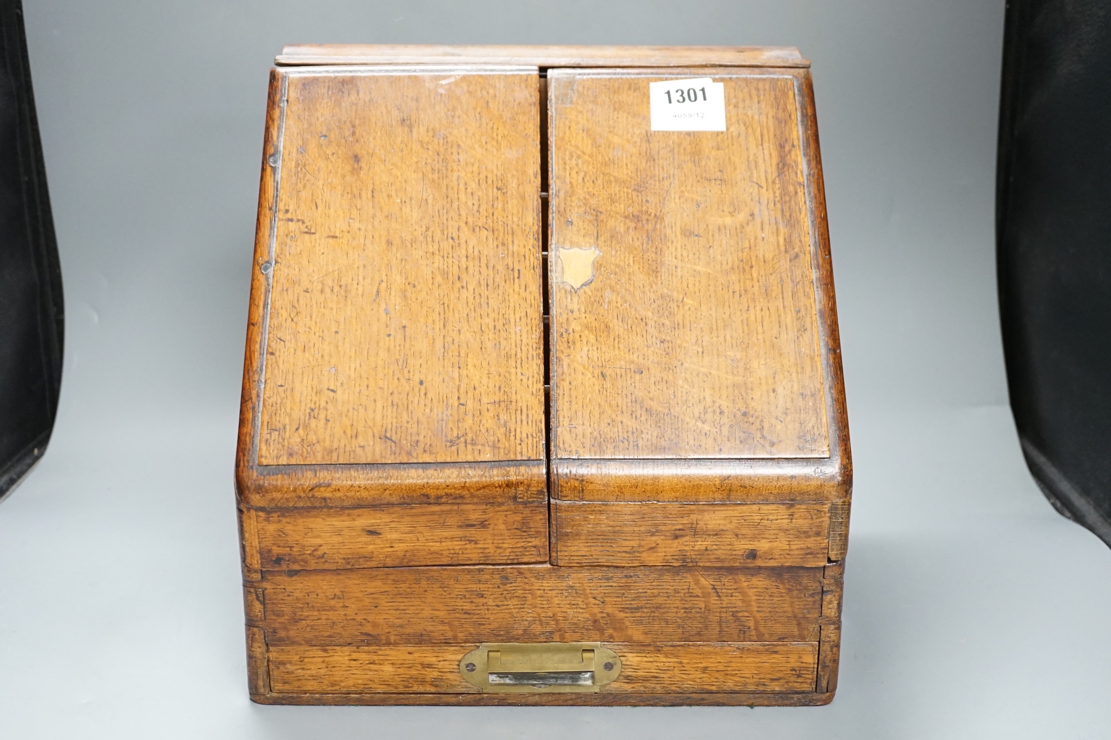 A Victorian oak stationery box with original fittings